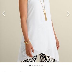 Sleeveless White Tunic. Scoop neck, asymmetrical criss-cross hem.
